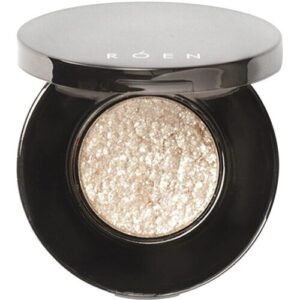 Runder Lidschatten in schwarzer Dose mit schimmerndem Puder.